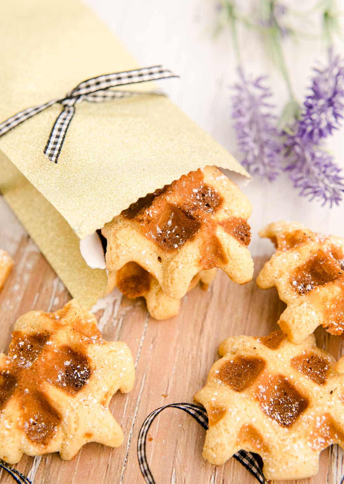 Waffle cookies on a wooden table.