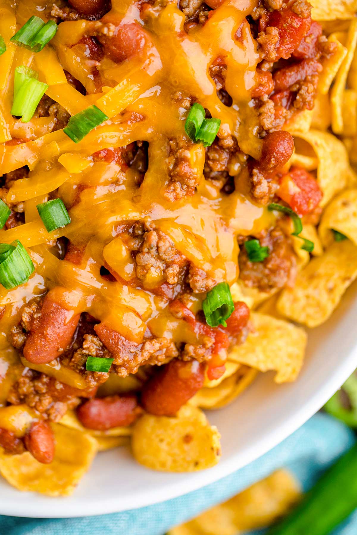 Close up of a bowl filled with frito chili pie.
