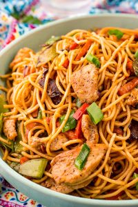 Close up of chicken lo mein in a bowl.