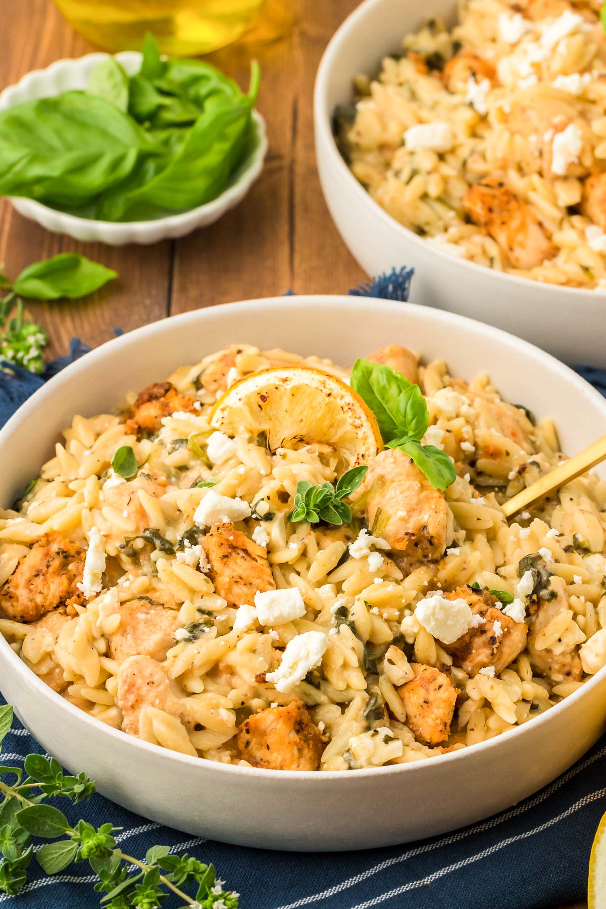 A white bowl filled with lemon chicken orzo.